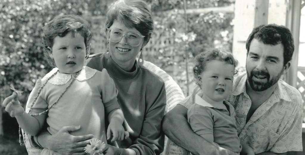 A monochrome picture of a family with two kids,